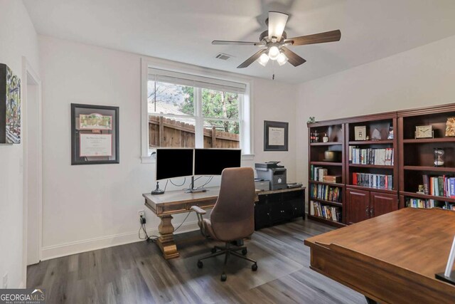 office space featuring visible vents, ceiling fan, baseboards, and wood finished floors