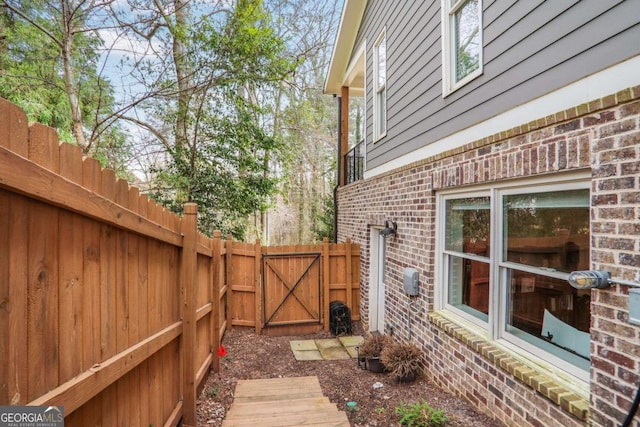 exterior space featuring fence and a gate