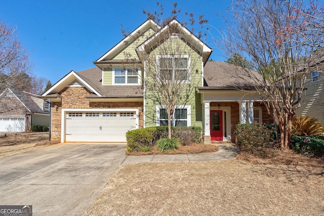 view of front of home featuring a shingled roof and concrete driveway