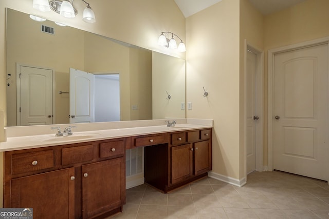 full bath with double vanity, visible vents, a sink, and tile patterned floors