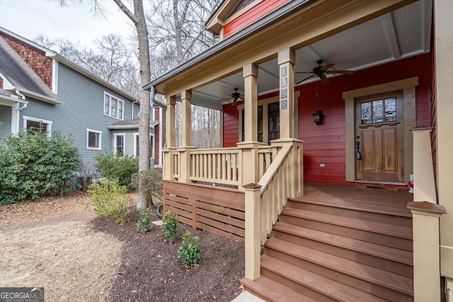 entrance to property with a ceiling fan and covered porch