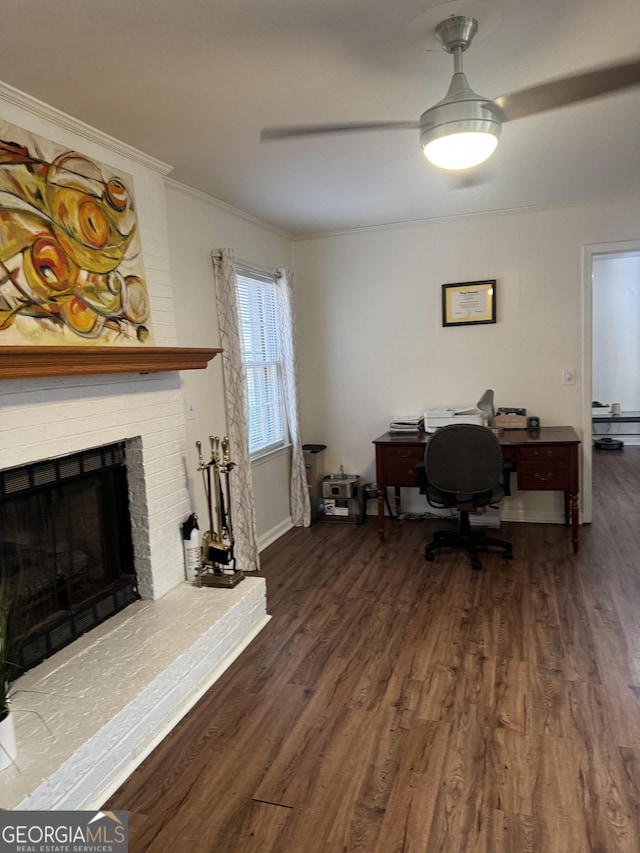 home office featuring a fireplace, crown molding, baseboards, and wood finished floors