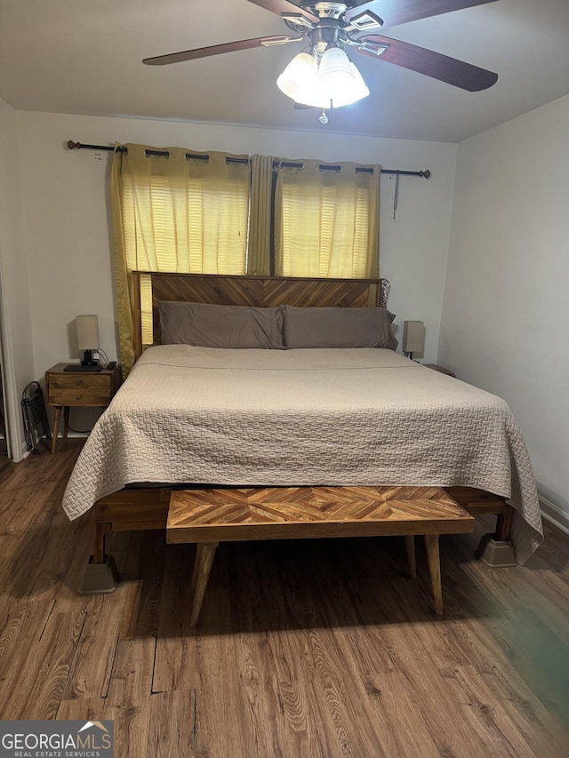 bedroom with ceiling fan and wood finished floors