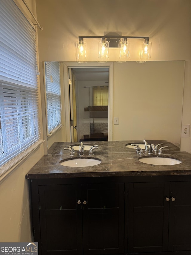 bathroom with double vanity and a sink