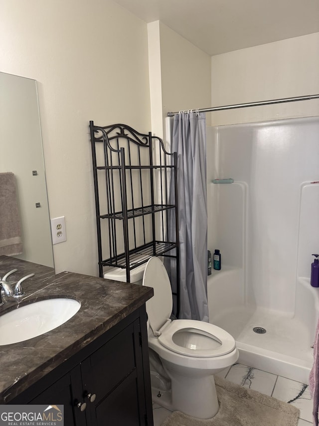 bathroom featuring toilet, marble finish floor, vanity, and a shower with curtain