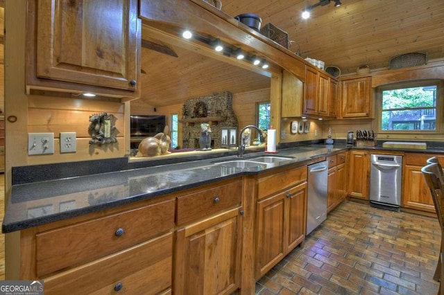 kitchen with wooden walls, wooden ceiling, brown cabinets, brick floor, and a sink