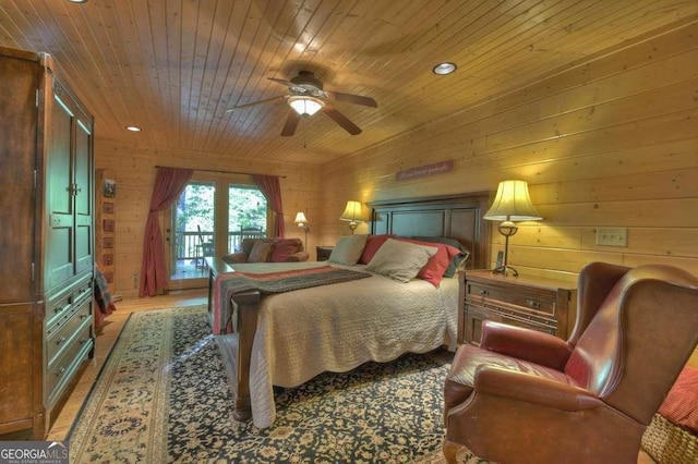 bedroom featuring wooden walls, a ceiling fan, light wood-style floors, wood ceiling, and access to outside