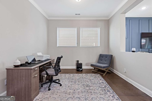 office space with dark wood-style floors, baseboards, visible vents, and ornamental molding