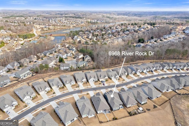 aerial view featuring a residential view and a water view