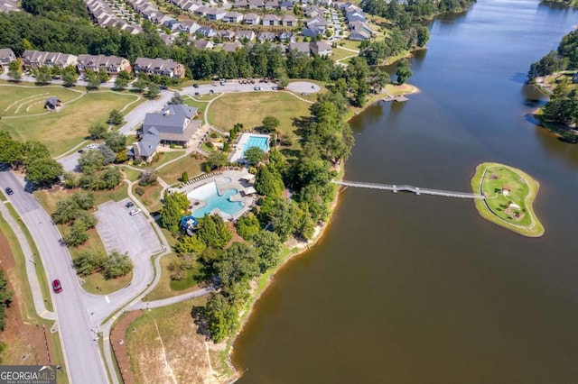 bird's eye view featuring a residential view and a water view