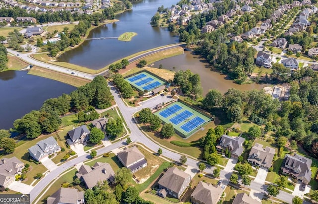 bird's eye view featuring a residential view and a water view