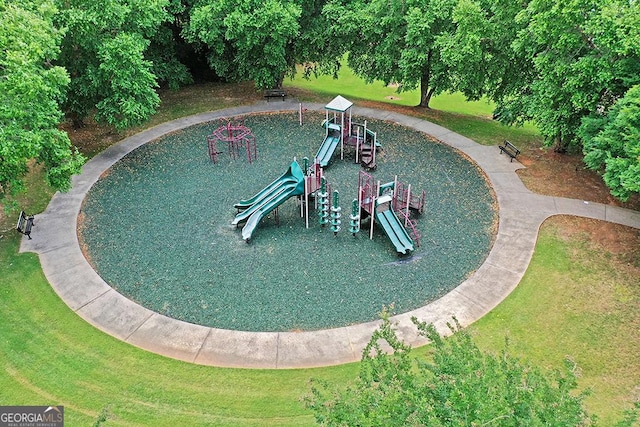 view of swimming pool featuring playground community and a yard