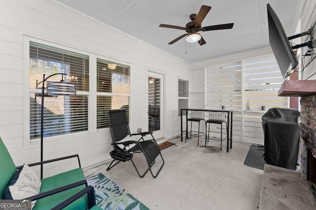 view of patio with ceiling fan and grilling area