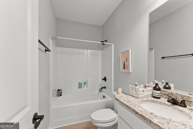 bathroom with toilet, shower / tub combination, and vanity