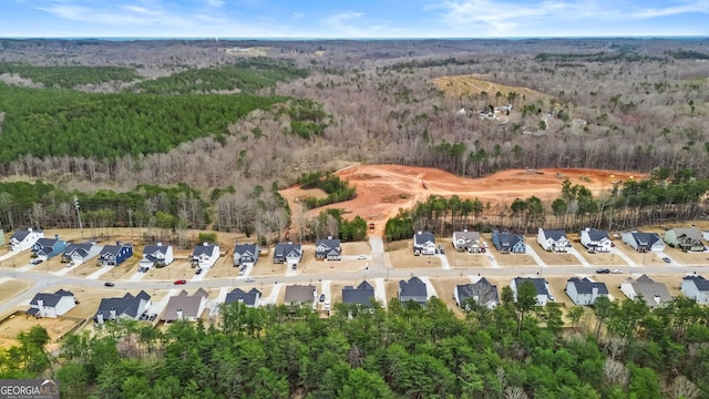 birds eye view of property with a residential view and a view of trees