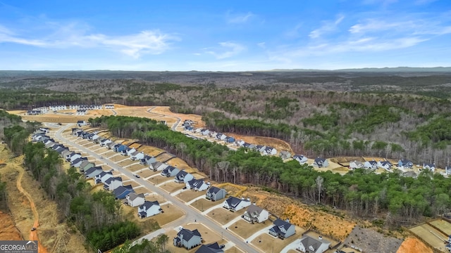 aerial view with a wooded view