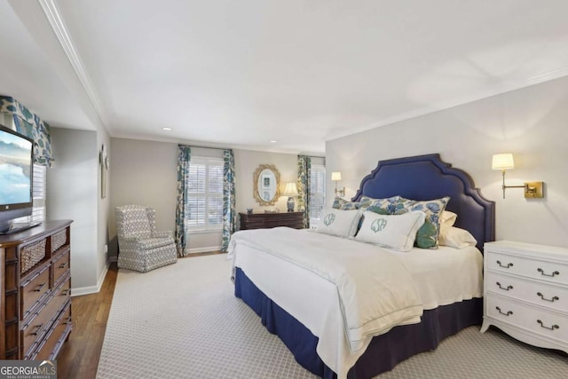 bedroom with recessed lighting, baseboards, wood finished floors, and ornamental molding