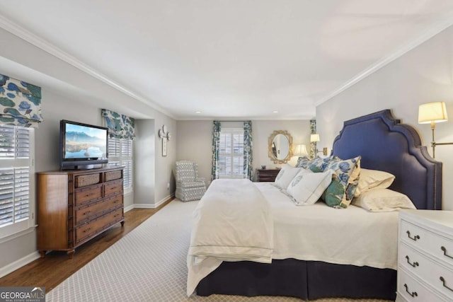 bedroom with ornamental molding, baseboards, and dark wood-style flooring