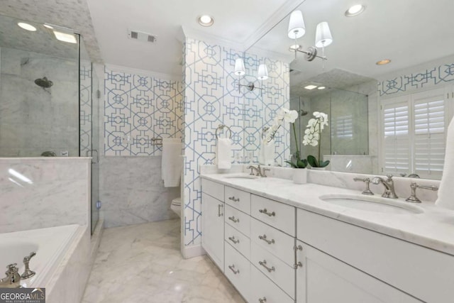 bathroom with a bath, visible vents, a shower stall, and a sink