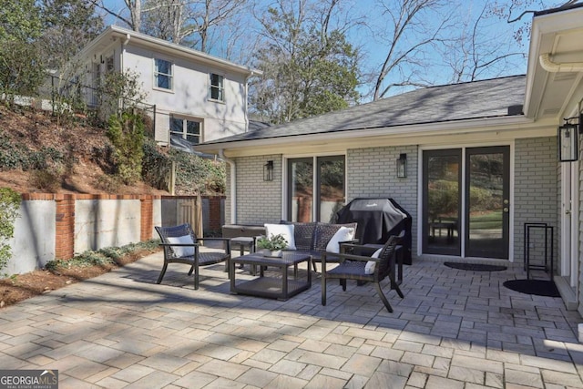 view of patio / terrace featuring outdoor lounge area and fence