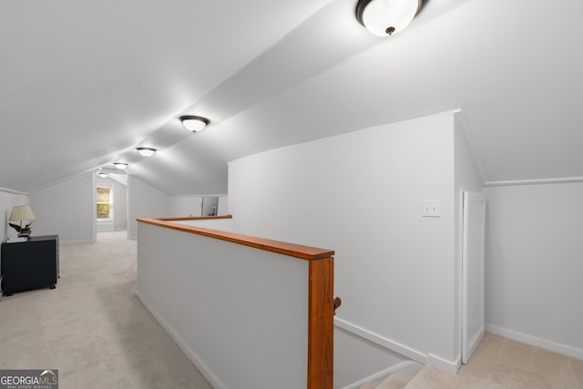 additional living space with light carpet, baseboards, and lofted ceiling