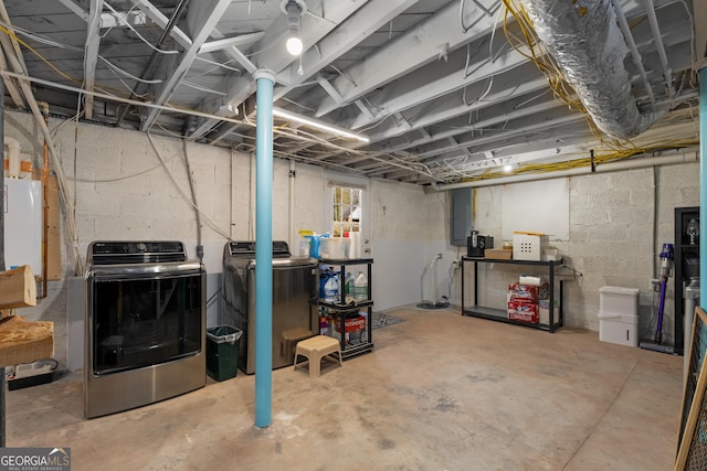 basement with electric panel and independent washer and dryer