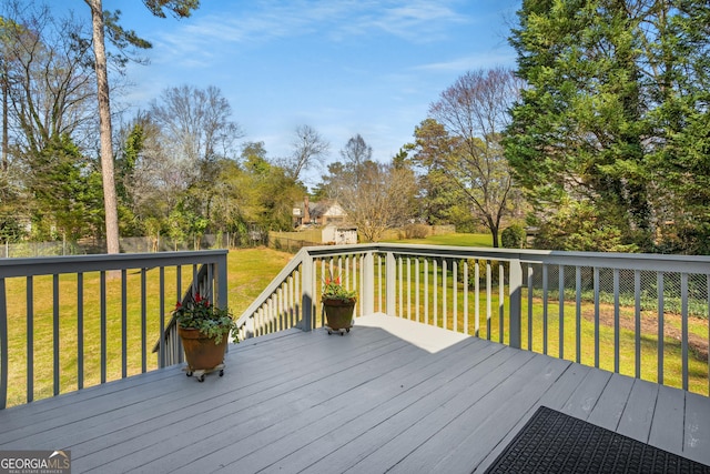 deck featuring a fenced backyard and a yard