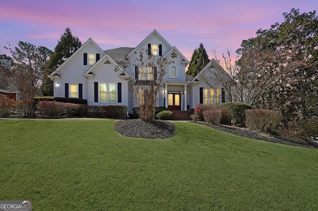 view of front facade with a yard