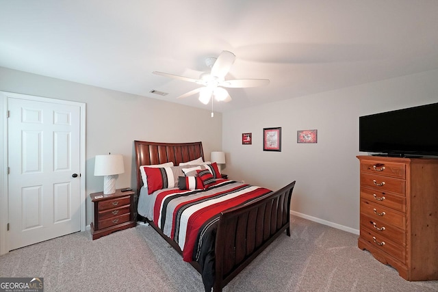 bedroom featuring baseboards, visible vents, carpet floors, and ceiling fan