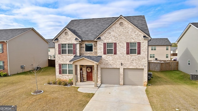 traditional home with roof with shingles, brick siding, fence, driveway, and a front lawn