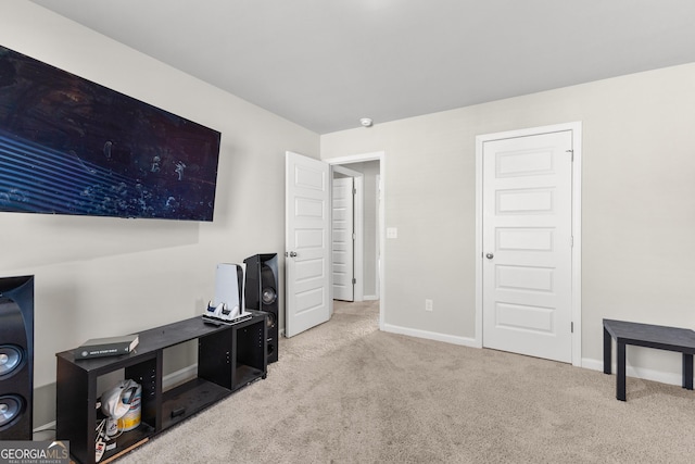 interior space featuring carpet flooring and baseboards