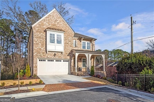 view of front of home featuring brick siding, covered porch, fence, a garage, and driveway