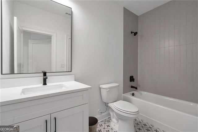 bathroom with toilet, baseboards, shower / bathing tub combination, and vanity