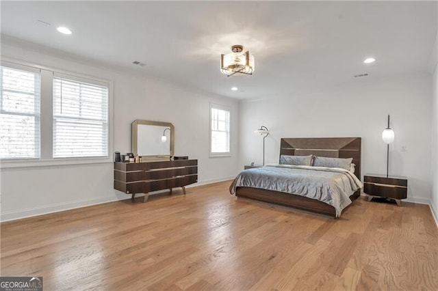 bedroom featuring baseboards, recessed lighting, visible vents, and light wood-style floors