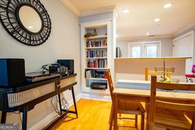 office area with light wood-type flooring, crown molding, baseboards, and recessed lighting