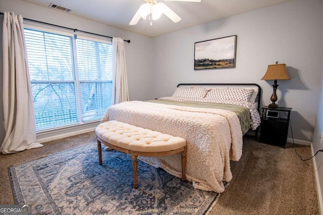 bedroom with ceiling fan, carpet, visible vents, and baseboards