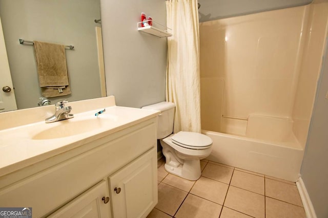 full bathroom featuring shower / bath combo, vanity, toilet, and tile patterned floors