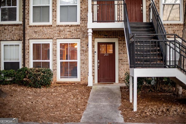 entrance to property with brick siding