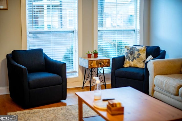 living room with wood finished floors and baseboards