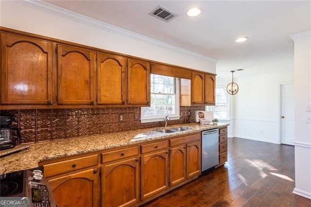 kitchen featuring a sink, visible vents, brown cabinetry, and dishwasher