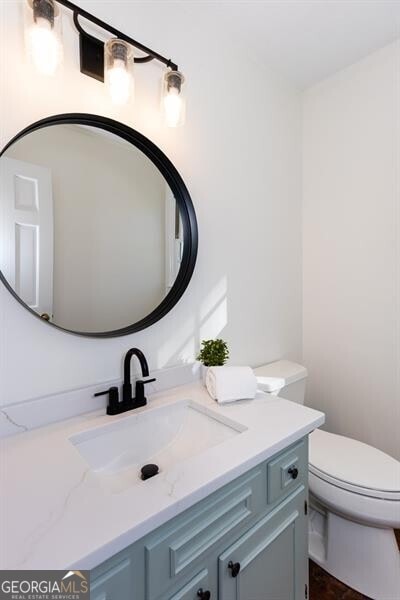 bathroom with vanity and toilet