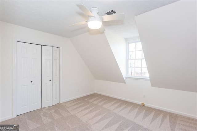 bonus room with carpet, visible vents, and baseboards