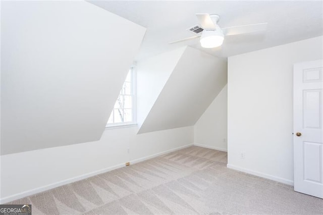 bonus room featuring visible vents, baseboards, a ceiling fan, lofted ceiling, and carpet