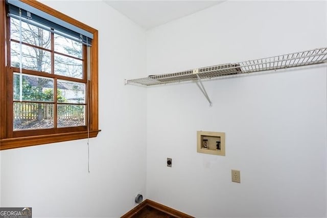 washroom featuring laundry area, hookup for a washing machine, electric dryer hookup, and baseboards