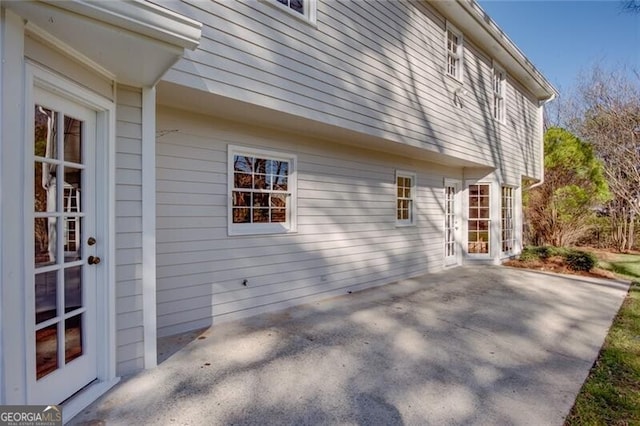 view of side of home featuring a patio