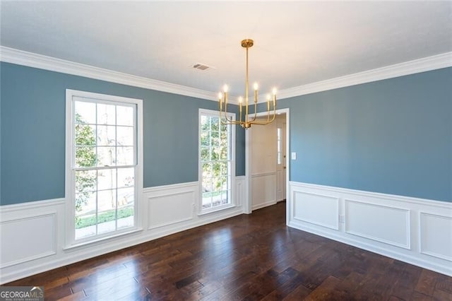 unfurnished dining area with a wainscoted wall, a notable chandelier, visible vents, and dark wood-style flooring