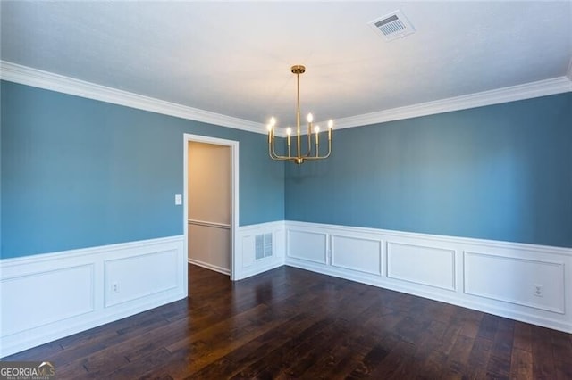 unfurnished room featuring ornamental molding, wood finished floors, visible vents, and an inviting chandelier