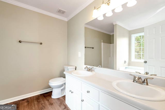 full bath featuring baseboards, a sink, toilet, and wood finished floors