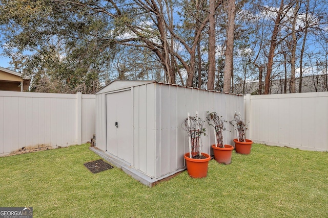 view of shed with a fenced backyard
