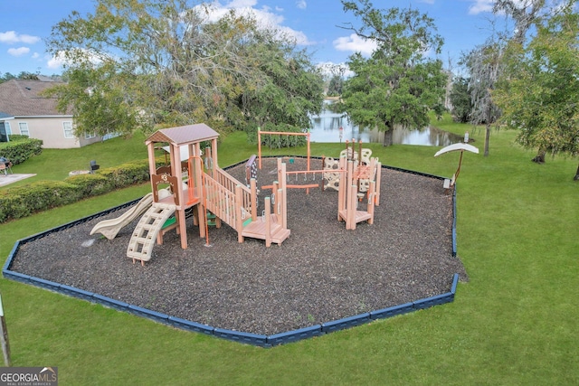 community play area with a lawn and a water view